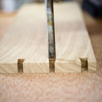 Ben Casson making a shelving unit in his workshop at Wobage Farm 2016